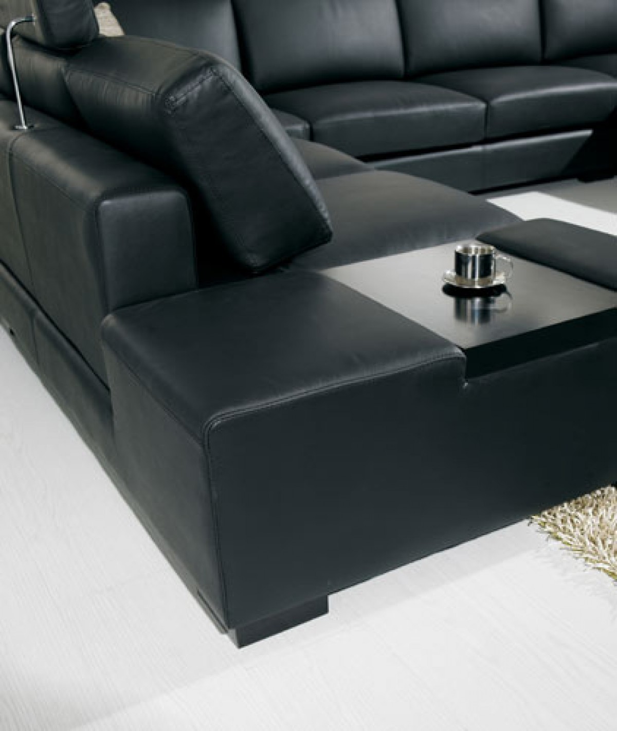 Contemporary Sectional Sofa Set A close up shot of the Amadeo Nero Sectional Available At AdvancedInteriorDesigns.com. This Black Sectional also features lights.