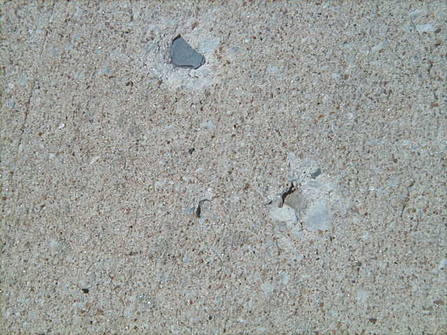 holes-in-concrete-driveway-lignite-or-shale-problem-sealgreen