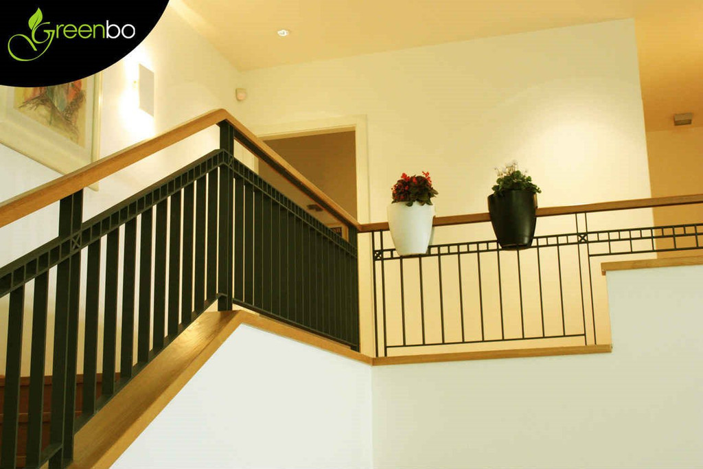 Greenbo railing planters on indoor stair railing.