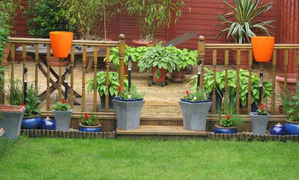 Greenbo railing planters on garden fencing.