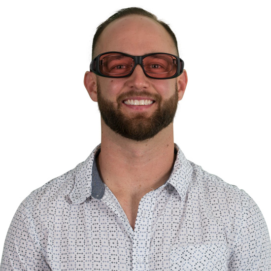 Man wearing WearOver TheraSpecs Indoor