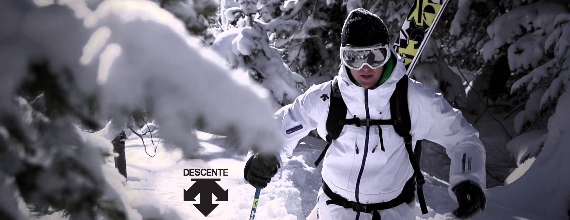 descente man skiing white ski jacket banner logo 1200x464 1