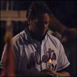 Mets player with battery operated candle